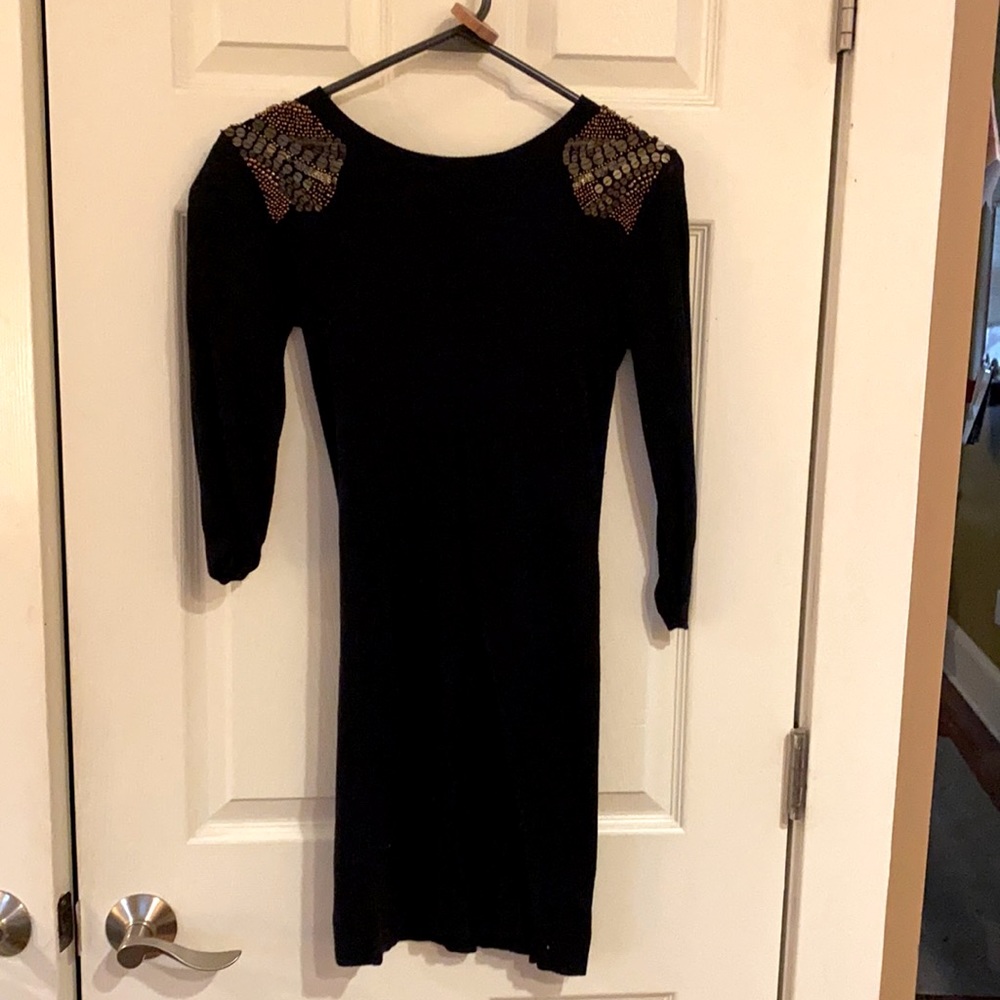 Black fitted sweater dress with metallic beading